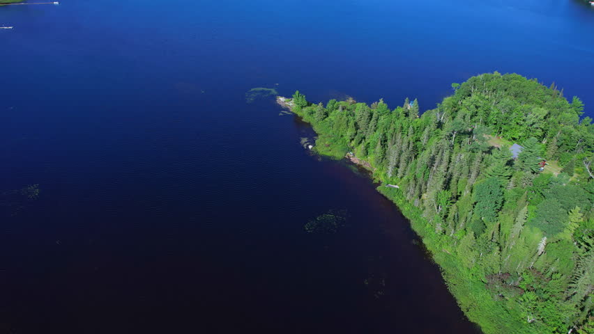 Pickerel Lake flight over view near Jacks Creek Armour, Ontario relaxing nature. Aerial depiction of the Ontario waters in Canada, North America. Shot from the sky at Lake and forest natural scenery.