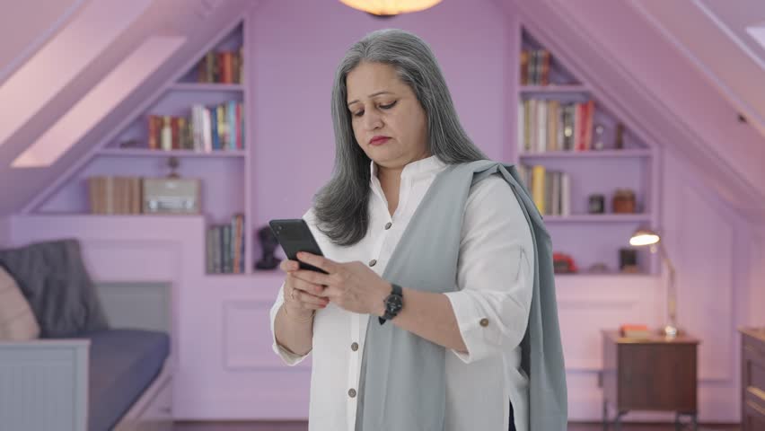 Angry Indian mother chatting on phone