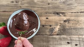 Strawberries with chocolate. Bowl with chocolate and strawberries. Worn wood background with space for copying. - Powered by Shutterstock - Get 15% off with code: PIKWIZARD15