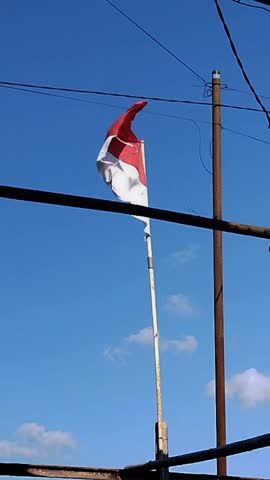 Waving flags of indonesia.in the edge of street. Red, white. Bendera. August, 17th