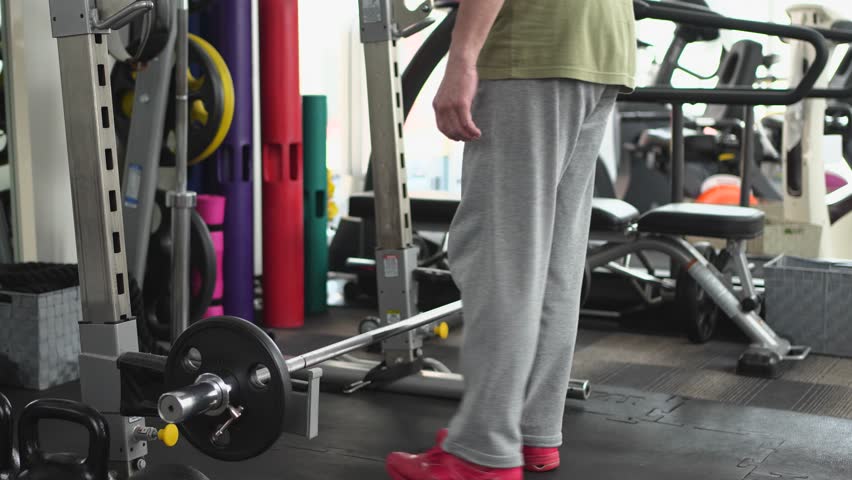 A man training his upper body with bent-over rows