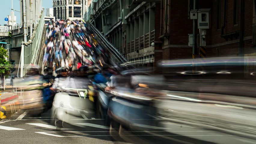 Time-lapse a motorcycle waterfall morning rush hour crowded motorcycles coming off the bridge Taipei Traffic Taiwan Asia	
