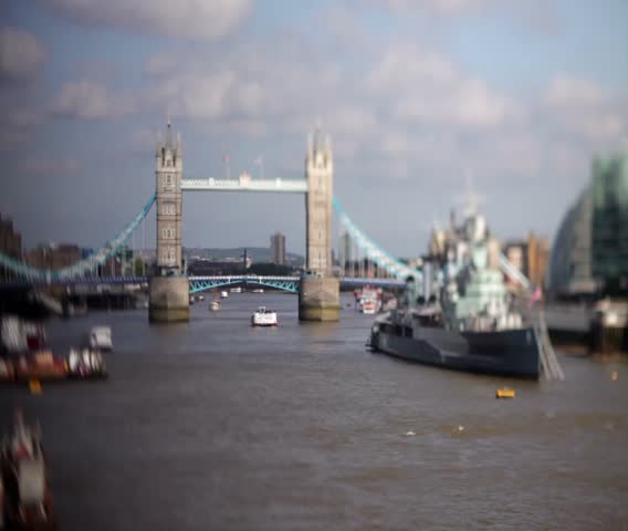 Time lapse, with tilt shift lens of boats on the Thames in London,  as Tower Bridge opens and closes for river traffic. Giving a creative dream like, toy town effect. 