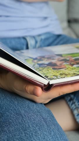 Woman Looking Family Photo Book with Photos, Happy Memories