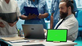 Diverse team of medics analyze x rays next to mockup copy space and discuss treatment plans in a medical office. Healthcare specialists working to provide diagnosis on insurance. Camera A. - Powered by Shutterstock - Get 15% off with code: PIKWIZARD15
