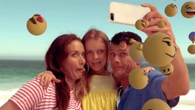 Taking selfie on beach, family surrounded by floating emoji animation. Vacation, summer, sand, ocean, sea, fun - Powered by Shutterstock - Get 15% off with code: PIKWIZARD15
