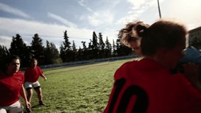 Women's rugby teams pushing against each other in a scrum during a match, displaying strength and teamwork.  - Powered by Shutterstock - Get 15% off with code: PIKWIZARD15
