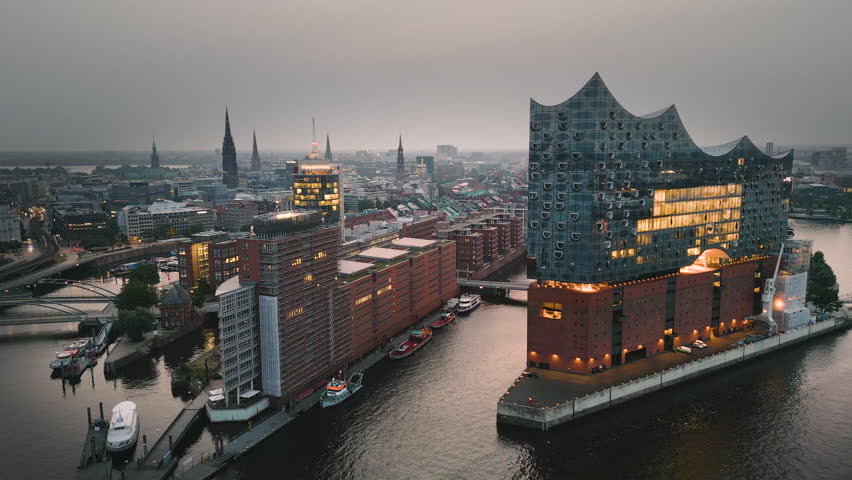 Drone shot revealing Night Elbphilharmonie (concert hall) , German harbor Hafen city , Elbe River , Hamburg , Germany