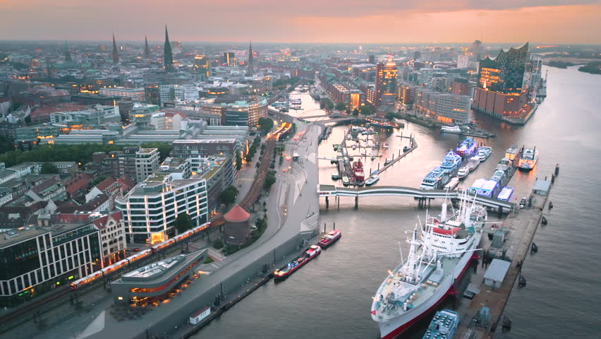 Hamburg harbor aerial skyline view at night fly over hamburg river in front hamburg Elbphilharmonie, Hafencity and downtown in Hamburg Germany.