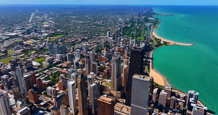 Flying above the high-rise architecture of Chicago downtown, Illinois, United States. Top view on Lake Michigan and splendid Lakeshore Drive.