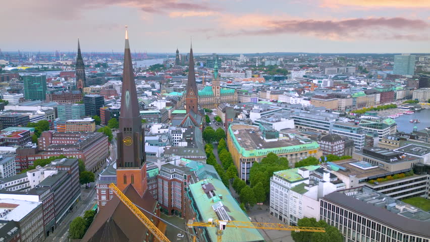 Hamburg city germany skyline aerial view in 4K, fly over old town in front main sqaure church and cathedral, town hall hamburg city panorama.