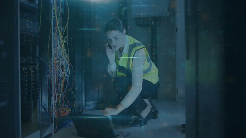 Technician working with cables and laptop, warning text animation over numbers. Technology, computer, data, cybersecurity, code, engineering - Powered by Shutterstock - Get 15% off with code: PIKWIZARD15