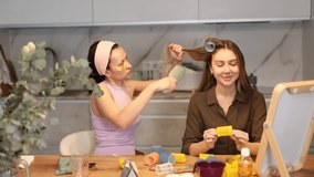 Adult woman doing hair perm with curlers to young woman - Powered by Shutterstock - Get 15% off with code: PIKWIZARD15