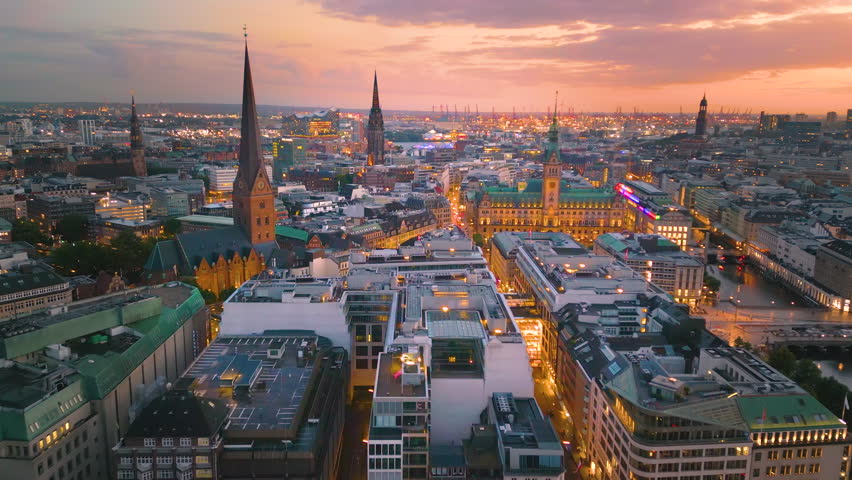 Hamburg city skyline aerial view drone footage of night Hamburg germany old town town hall and main sqaure in city centre.