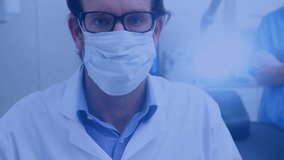 Medical professional holding dental tools with social media icons animation over image. Dentist, healthcare, technology, dental care, digital - Powered by Shutterstock - Get 15% off with code: PIKWIZARD15