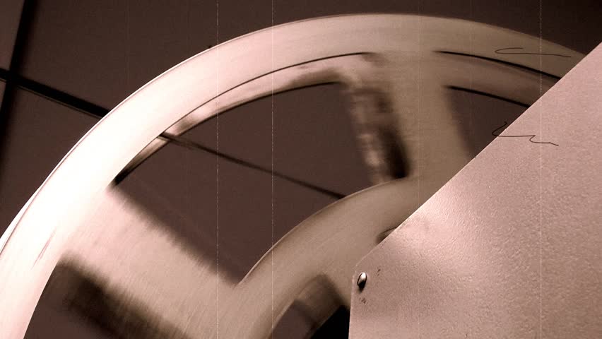 Old 35mm Movie Retro Projector - Close Up Of Film Reel in Sepia (with audio)