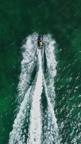 Aerial view to motor yacht floating in the sea