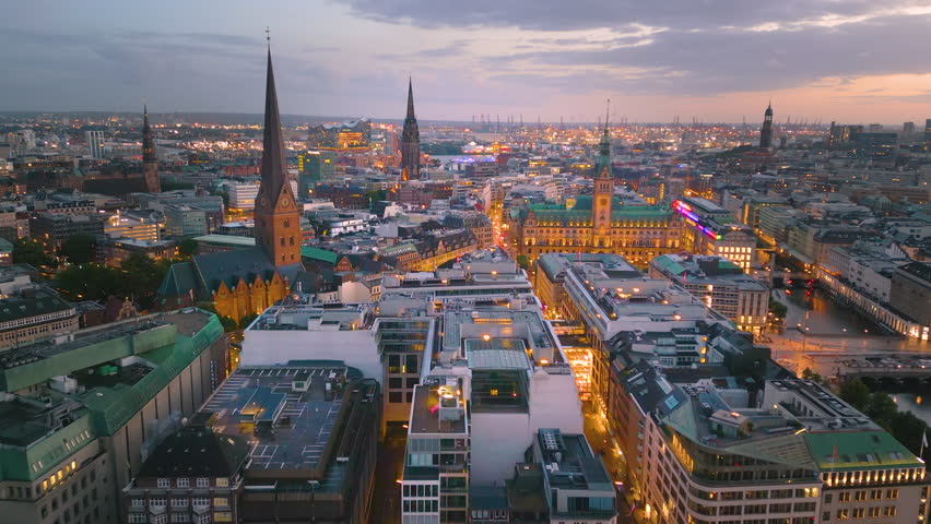 Aerial: Hamburg night aerial skyline top view drone footage of city Hamburg germany, town hall downtown view.