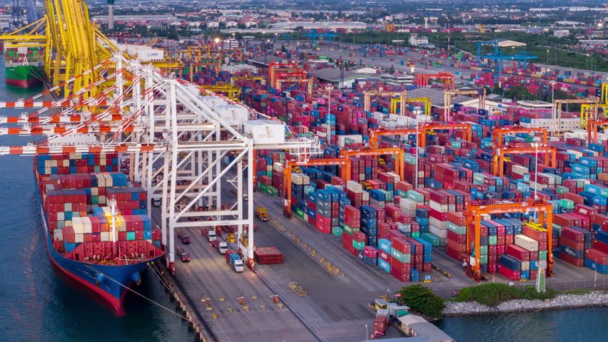 time lapse day to night Cargo Container Ship international customs sea port. Crane loading cargo working at industry port. working at night shift import export shipping concept.