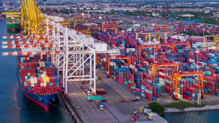 time lapse day to night Cargo Container Ship international customs sea port. Crane loading cargo working at industry port. working at night shift import export shipping concept.