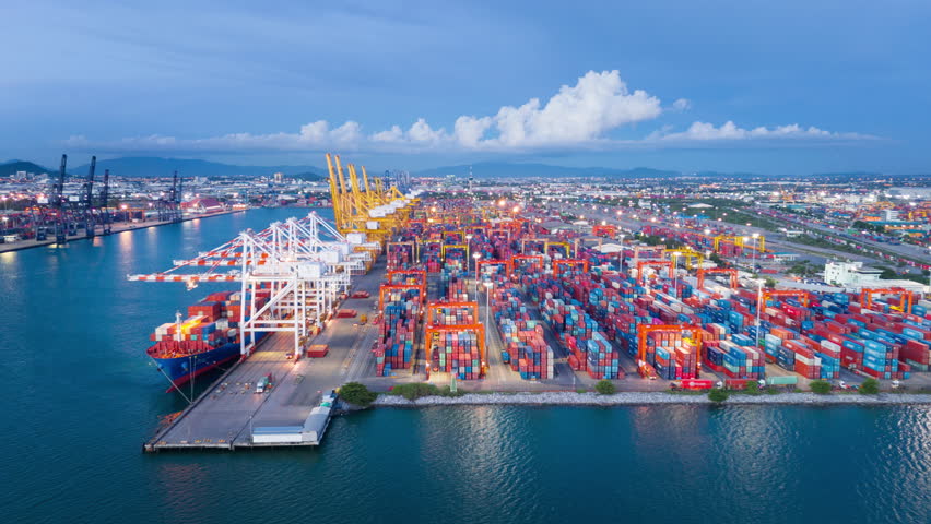 time lapse day to night Cargo Container Ship international customs sea port. Crane loading cargo working at industry port. working at night shift import export shipping concept.