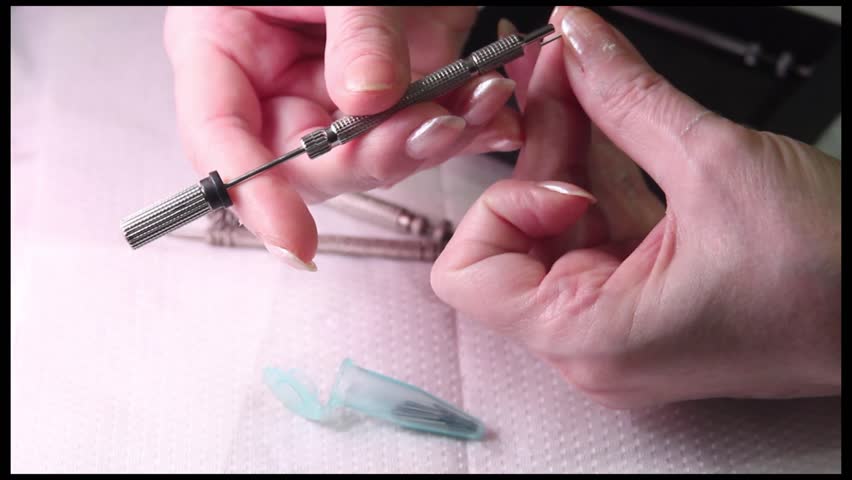 Acupuncture (medicine): demonstration of SuJok needles and inserter.