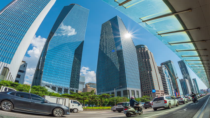 Cityscape,Traffic on the road in front of a modern design building financial business district and beautiful sky,At Yeouido, Seoul, South Korea.
