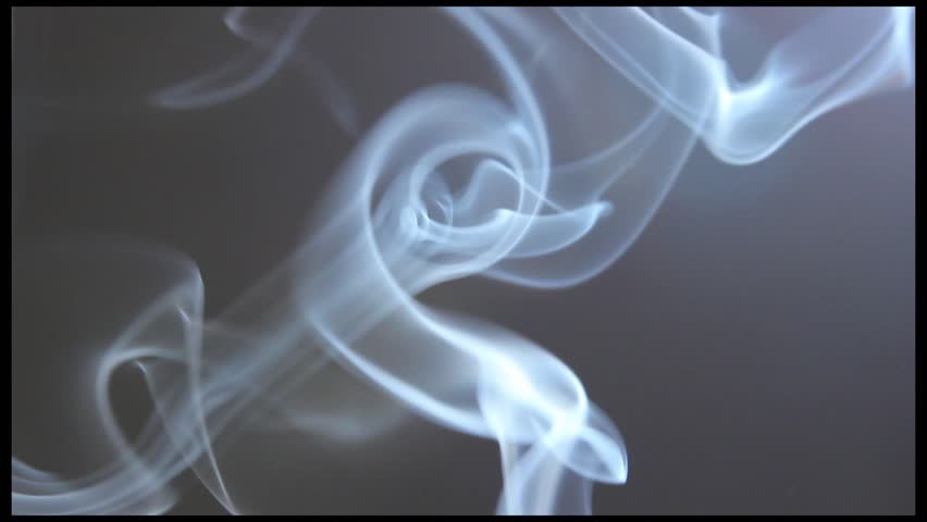 Smoke on a gray background, fire outside the shot.