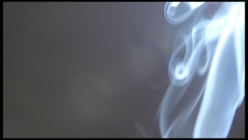 Smoke (Fume, Reek) on a gray background. Fire outside the shot.