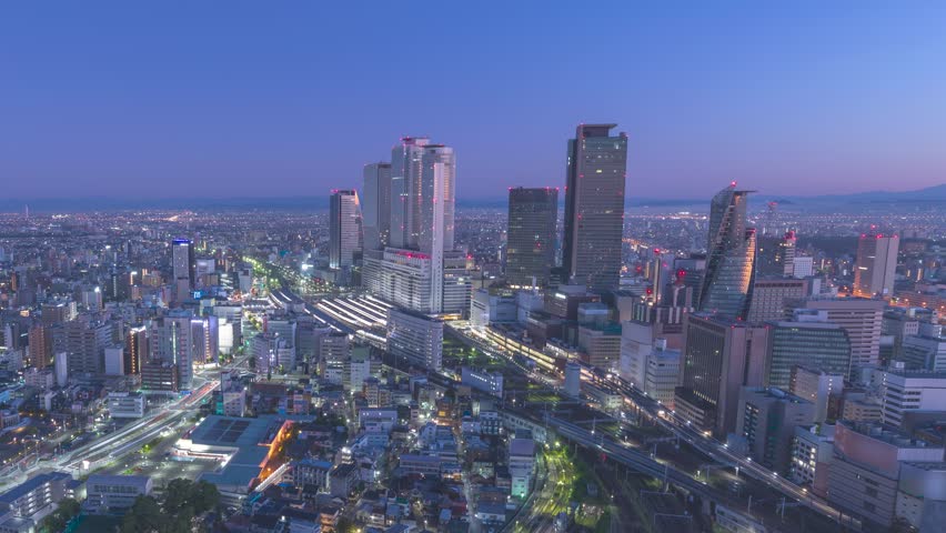 Nagoya Aichi Japan time lapse city skyline night to day at railway station and business center