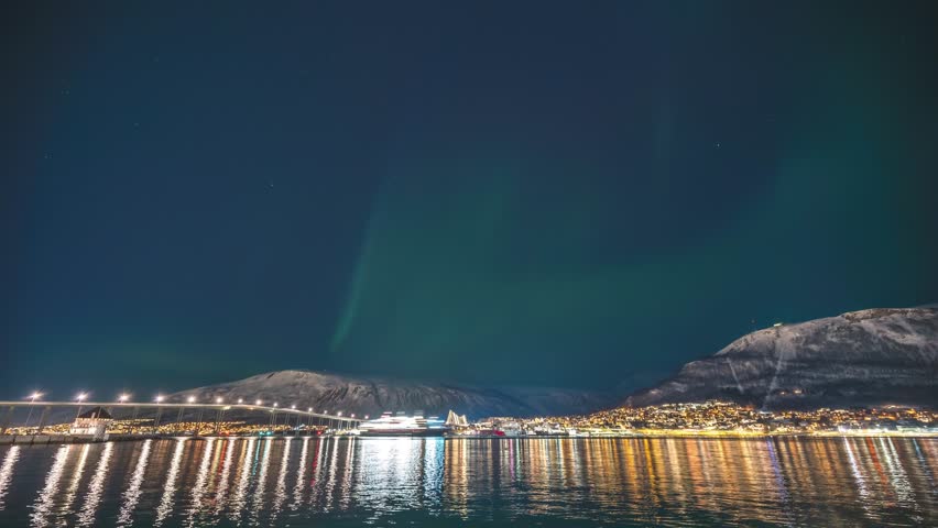 Tromso Norway time lapse of the aurora borealis northern lights at city sentrum skyline harbor