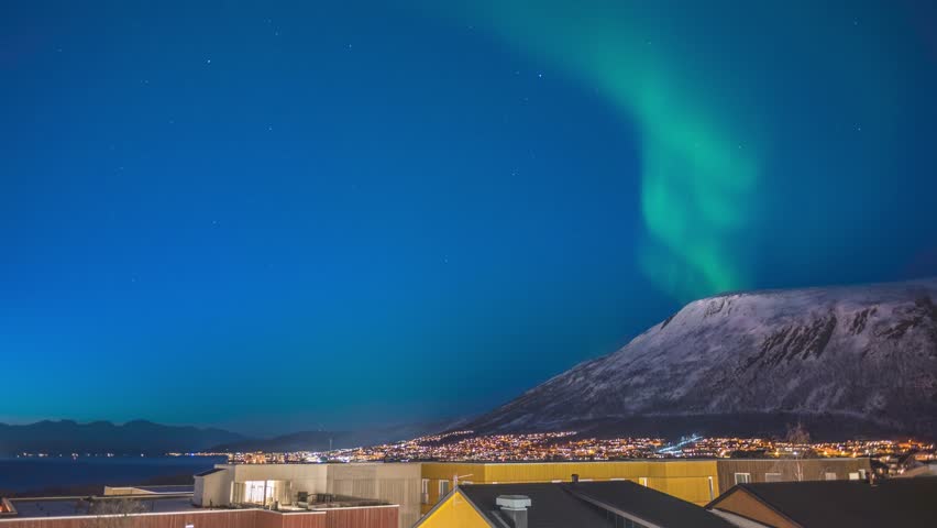 Tromso Norway time lapse of the aurora borealis northern lights winter landscape at Tromsdalstinden