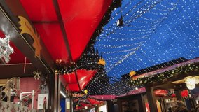 A Christmas market with a red tents and view of Dom cathedral at background at twilight - Powered by Shutterstock - Get 15% off with code: PIKWIZARD15