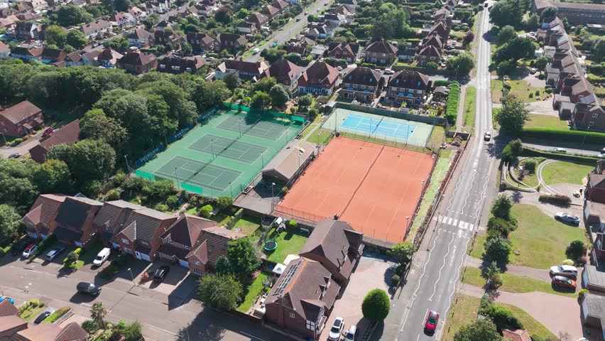 Aerial filming of a tennis court on a busy road in Seaford, UK