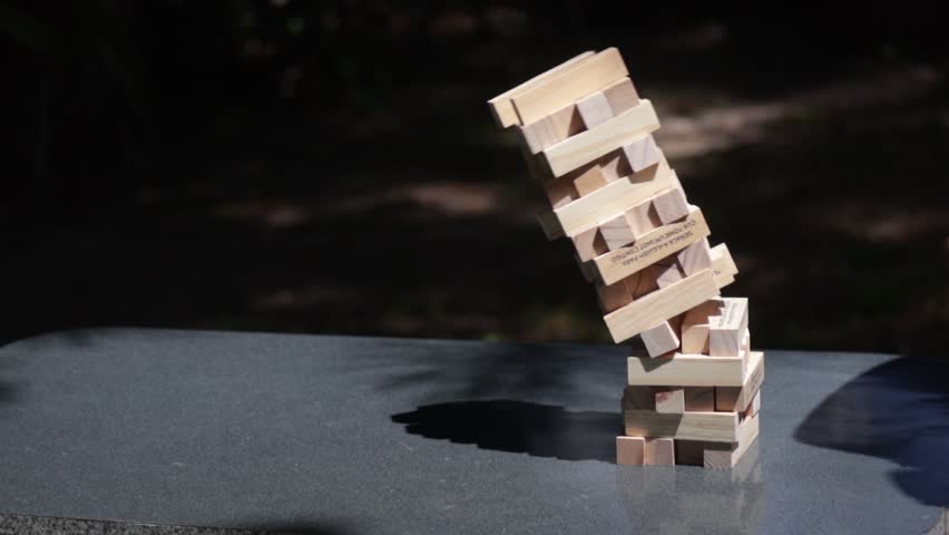 Photography for dynamic scenes, falling, a fully built toy tower collapses on the table