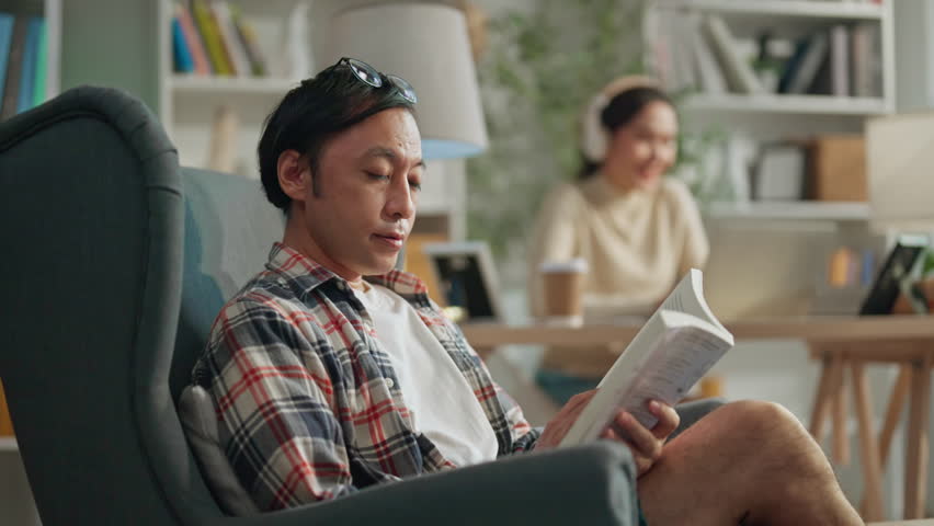 mature adult male japanese man reading book relax casual at home weekend sunday morning asian couple stay home together casual relax morning positve good vibe family lifestyle togerther - Powered by Shutterstock - Get 15% off with code: PIKWIZARD15