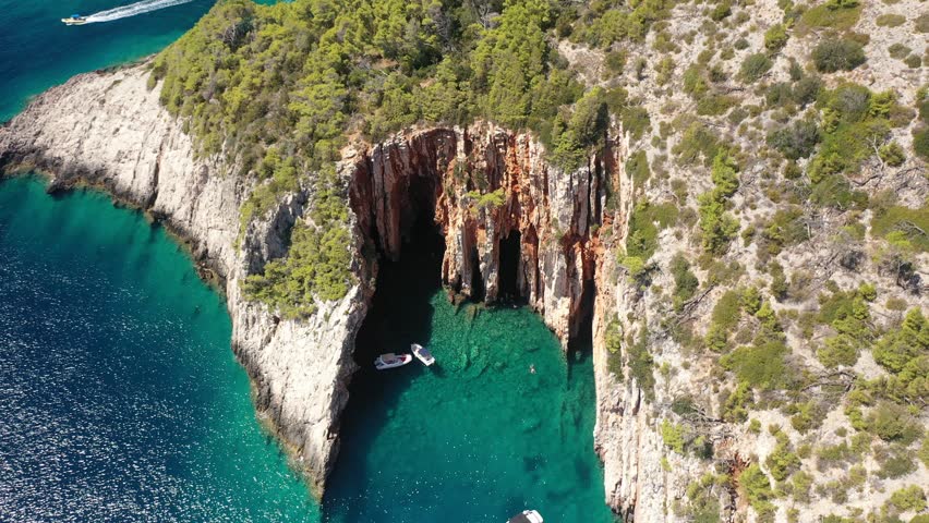 Red Rocks, Hvar, Croatia - Close-Up Aerial Of The Coastal Cliffs, Croatia. Detailed Drone Footage Of The Red Rocks On Hvar Island, Capturing The Dramatic Cliff Faces And Surrounding Azure Waters.