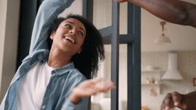 Happy married couple African American love family man guy boyfriend husband dancing with woman wife girlfriend girl affectionate romantic dance celebrate anniversary valentine's day together at home - Powered by Shutterstock - Get 15% off with code: PIKWIZARD15