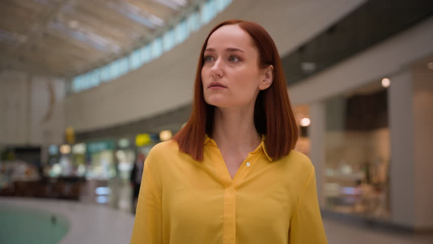 Confident Caucasian businesswoman female girl business woman client consumer buyer customer walking stroll supermarket mall looking choosing clothes department walk goes boutique store discount indoor