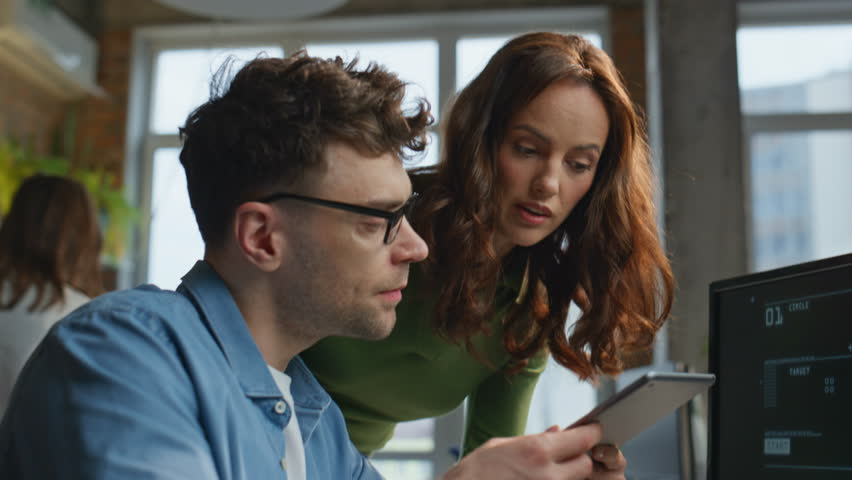 Office couple discussing business results looking computer in buro agency closeup. Rejoicing colleagues giving high five in panoramic cabinet. Two happy man woman working together at corporate room