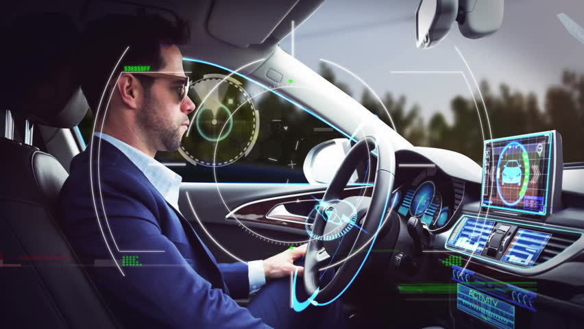 Man driving car with futuristic digital interface animation over dashboard and windshield. Technology, innovation, augmented reality, high-tech, smart, transportation - Powered by Shutterstock - Get 15% off with code: PIKWIZARD15