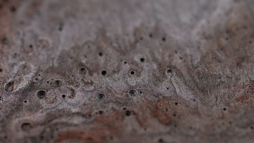 Sparkling gel. Flowing ink liquid. Silver emulsion black bubbles motion defocused glowing paint wave cascade abstract shiny art blur background.