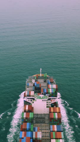 Aerial view of international containers cargo ship. Logistics, import and export concept.