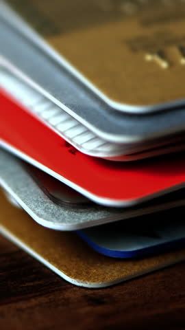 Time lapse of a stack of credit cards close up.