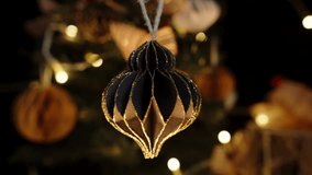 Spinning Christmas Ornaments in Various Designs, Hanging Gracefully Against the Background of Twinkling Lights. - Powered by Shutterstock - Get 15% off with code: PIKWIZARD15