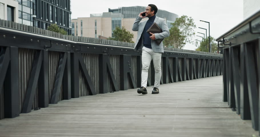 Bridge, business and man with happiness in phone call for communication and networking in New York. Male person, employee and smile or satisfied on conversation or consultation for real estate