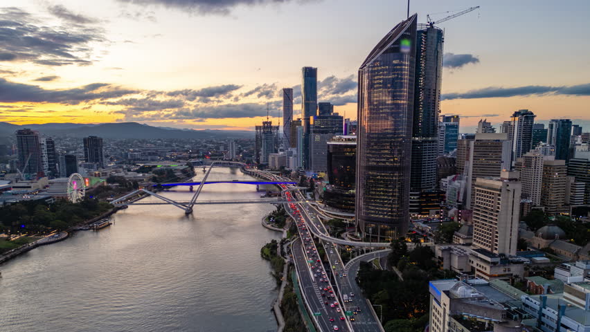 Aerial hyperlapse, dronelapse video of Brisbane city in Australia from sunset to night