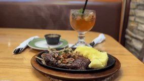 Grilled ribeye steak with a side of mashed potatoes - Powered by Shutterstock - Get 15% off with code: PIKWIZARD15