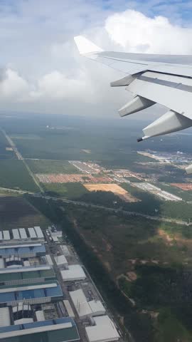 the view of Kuala lumpur city Malaysia from above during takeoff and flight from airplane video