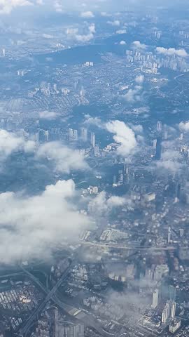 the view of Kuala lumpur city Malaysia from above during takeoff and flight from airplane video